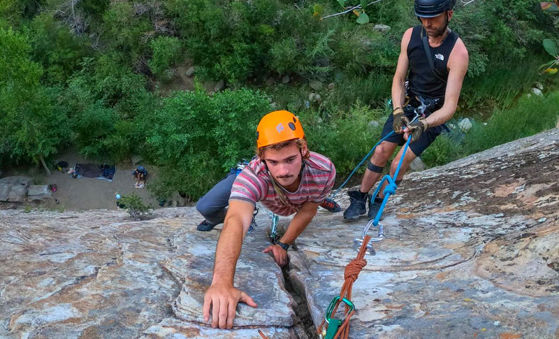 Aerial view of a young Santa Barbara rock climber approximately 100 feet off the ground