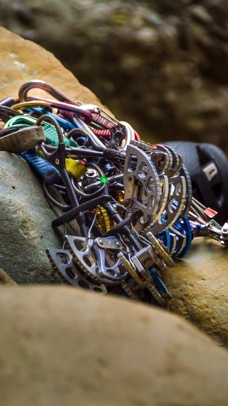 Rack of climbing cams and gear on sandstone during a Santa Barbara climbing adventure.